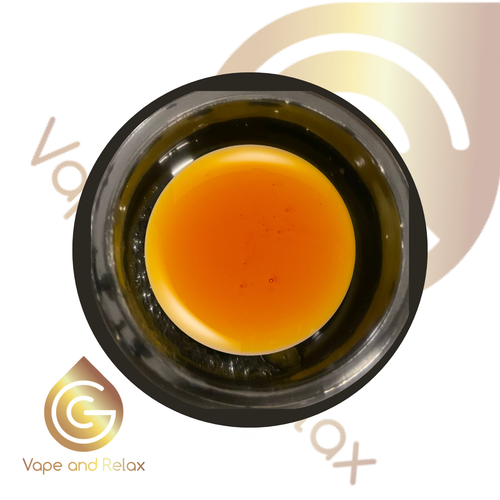 A close-up top view of a glass container filled with thick amber liquid, featuring Vape and Relax and a gold drop logo in the background, highlighting the premium CBD Gold 80% Cannabinoids | 1 gram vape product.